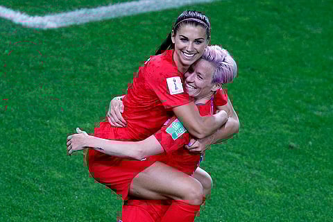 Alex Morgan Retires: United States' Megan Rapinoe, right, congratulates teammate Alex Morgan after scoring her fifth goal